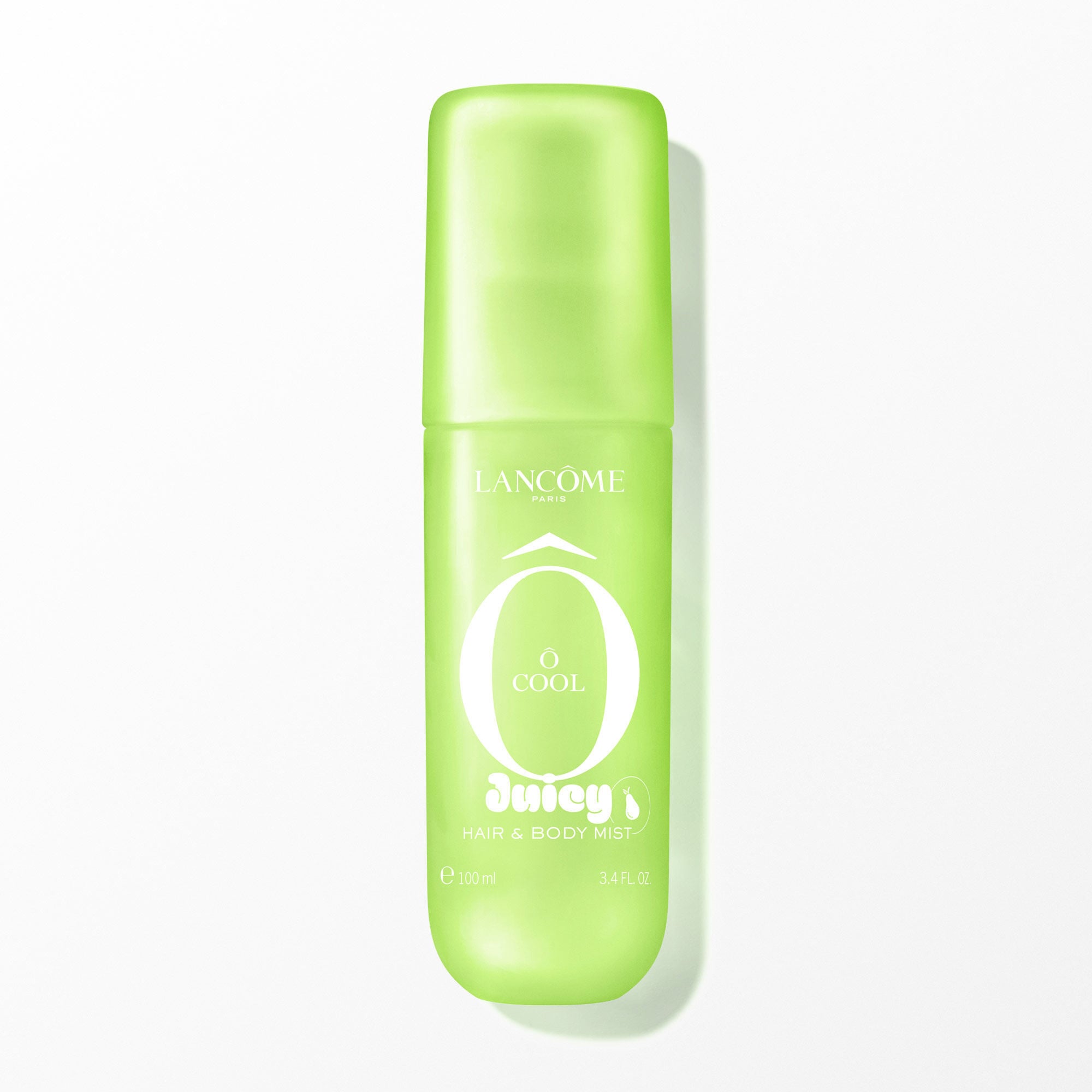 A green transparent spray bottle with a soft touch finish, containing a clear liquid, with white text on the front. The bottle is positioned vertically in the center, casting a subtle shadow on the white background. The image is brightly lit from the front, with soft, even artificial lighting.